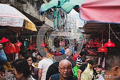 People buying vegetables and fruits on street food market in HongKong Editorial Stock Photo