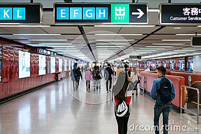 People walking inside Central MTR station / underground subway train station in HongKong Editorial Stock Photo