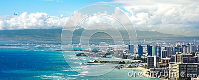 Honolulu Coastline with an Airplane Flying Stock Photo