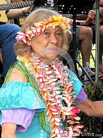 Honolulu, Hawaii - 5/2/2018 - Senior Hawaiian woman performing traditional hula dance Editorial Stock Photo