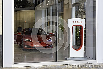 HONOLULU HAWAII USA - APRIL 2, 2019: Tesla Motors showroom with a Tesla Model S in the foreground. Editorial Stock Photo