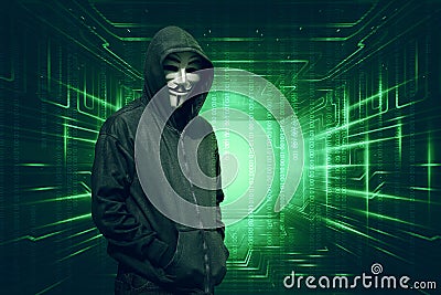Hooded with anonymous mask standing with binary code Editorial Stock Photo