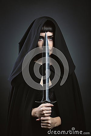 Hooded fantasy assassin Stock Photo