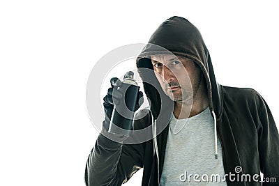 Hooded graffiti artist with spray paint can Stock Photo