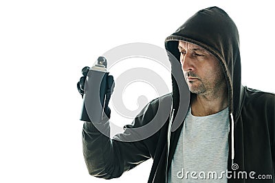 Hooded graffiti artist with spray paint can Stock Photo