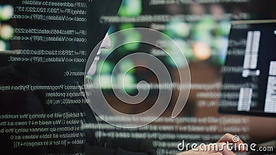 Hooded hacker breaking security system at data hologram closeup. Man pointing Stock Photo