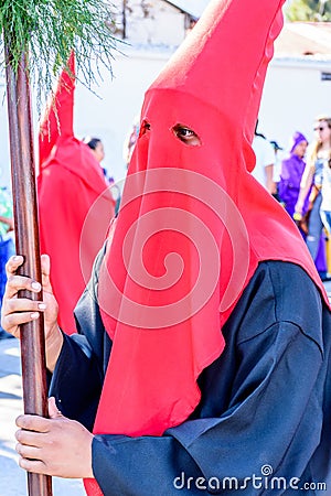 Hooded man in Lent procession, Antigua, Guatemala Editorial Stock Photo