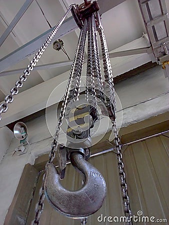 Hook and chains of mechanical old crane Stock Photo