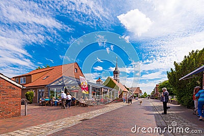 HOOKSIEL, GERMANY - JUNE 11, 2017: View to the street and shell museum. Copy space for text. Editorial Stock Photo