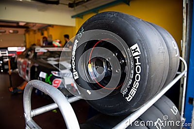 Hoosier race tire for car, racing wquipment in team workshop Editorial Stock Photo