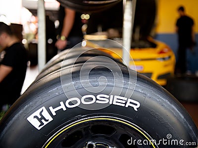 Hoosier race tire for car, racing wquipment in team workshop Editorial Stock Photo