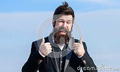 Hopeful and confident about future. Thumbs up gesture. Man bearded optimistic businessman wear formal suit sky Stock Photo