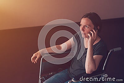 Hopeful female person with disability talking on mobile phone Stock Photo