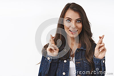 Hopeful, optimistic and determind attractive brunette female hope, praying for dream come true, standing wishful over Stock Photo