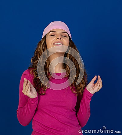 Hopeful woman wearing a pink scarf Stock Photo