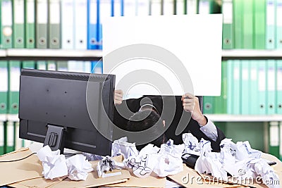 Hopeless businessman with blank banner Stock Photo