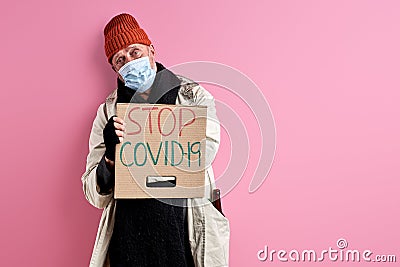 hopeless homeless man want covid-19 to be stopped Stock Photo