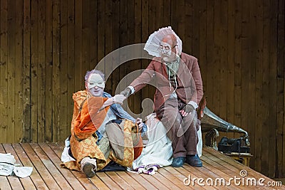 Actors on stage during a theatre play Stock Photo