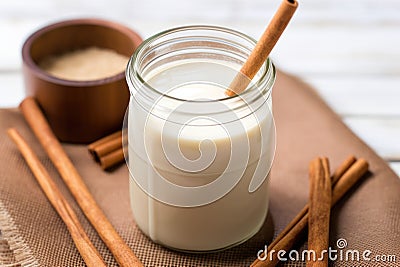 horchata in a glass jar with a striped straw Stock Photo