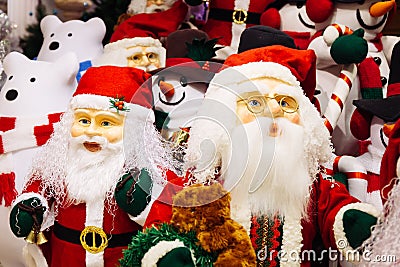 Horde of Santa Claus dolls and polar bears dolls on christmas background. Stock Photo