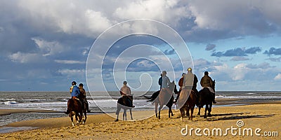 Horesback riders on beach Editorial Stock Photo