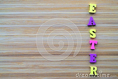 Horiontal inscription Easter made from small wooden color letters Stock Photo