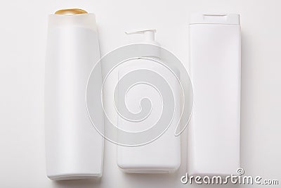 Horiontal shot of plastic bottles with beauty products, empty space for your design. Body care products. Cosmetic concept. Shampoo Stock Photo