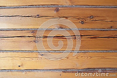 Horisontal wooden log brown wall decorated with rope Stock Photo