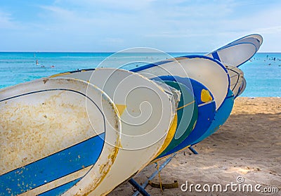 Surf Boards stacked in line on Hawaiian Beach Stock Photo