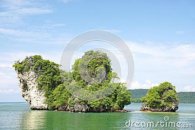 Horizon view of a big horizontal rock cliff with green vegetation, Krabi Thailand. Stock Photo