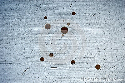 Horizontal background of dirty white wooden surface with scuff and round brown spots. Stock Photo