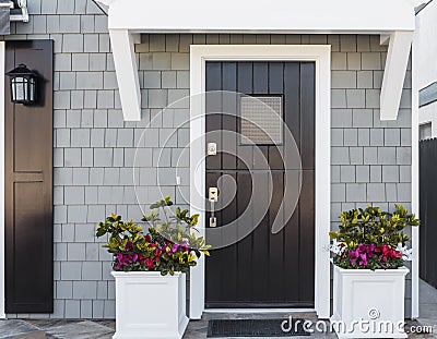 Horizontal of black front door to family home Stock Photo