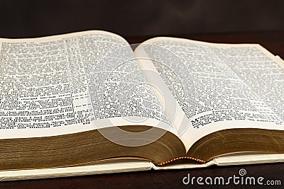 Close-up Photograph of Open Old Bible On Brown Stock Photo