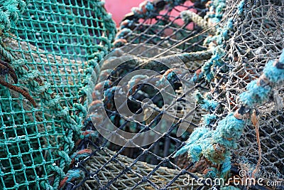 Horizontal closeup detail of colorful weathered prawn trap on a dock in western Scotland Stock Photo