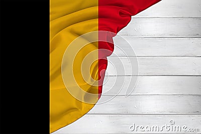 Horizontal colored national flag of modern state of Belgium, beautiful silk, white wood background, concept of tourism, economy, Stock Photo