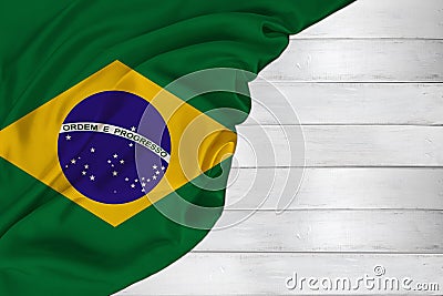 Horizontal colored national flag of modern state of Brazil, beautiful silk, white wood background, concept of tourism, economy, Stock Photo