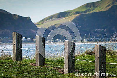 Fence line at hilltop scenic lookout, Makorori Headland, near Gisborne East Coast, North Island, New Zealand Stock Photo