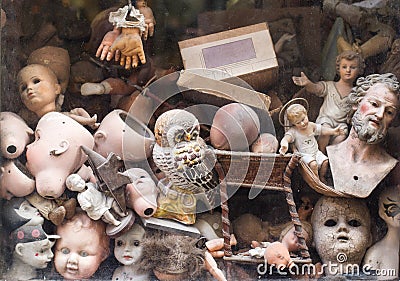 Close up of puppet toy parts behind a shop window Stock Photo