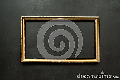 Horizontal gold thin picture frame on black Stock Photo