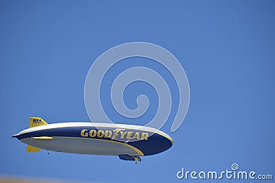 Horizontal image of the Goodyear Blimp against a clear blue sky Editorial Stock Photo