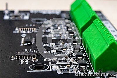 Horizontal integrated circuit chip controls electronic output zones Stock Photo