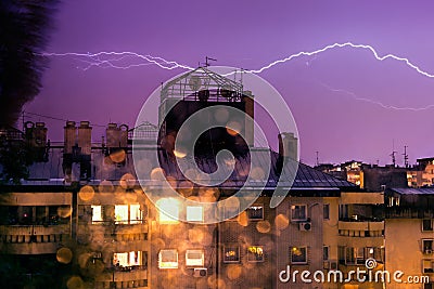 Horizontal lightning, night storm in the city Stock Photo