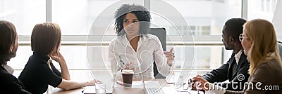 Horizontal photo african female boss talking at corporate meeting Stock Photo