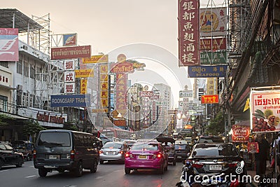 BANGKOK, THAILAND - October 2017: Traffic and advertisements everywhere during the day in Yaowarat Road, Chinatown. Editorial Stock Photo