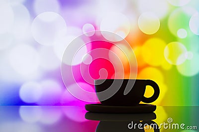 Horizontal photo of silhouette coffee cup on colorful bokeh back Stock Photo