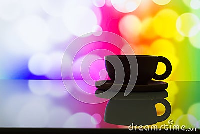 Horizontal photo of silhouette coffee cup on colorful bokeh back Stock Photo