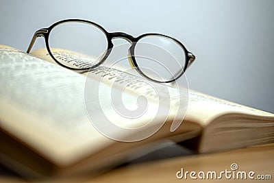 Horizontal photo in vintage style glasses and an old book Stock Photo