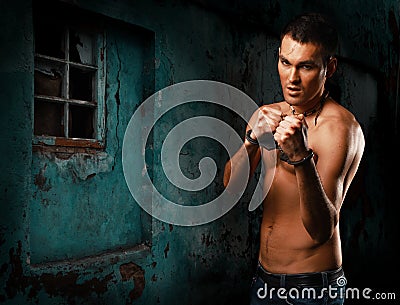 Horizontal portrait muscular young guy street-fighter Stock Photo