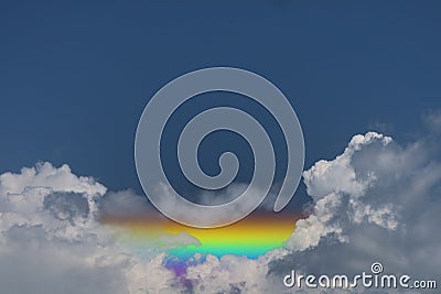 horizontal rainbow back on heap blue cloud Stock Photo