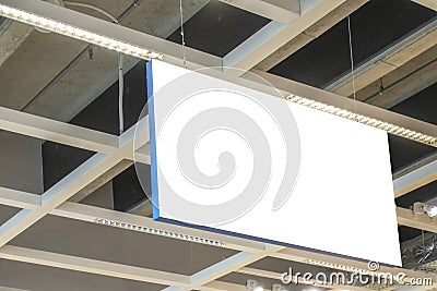 Mock up. Horizontal rectangular white empty signage, information board inside in shopping mall, store Stock Photo